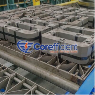 A collection of transformer cores ready for delivery. In the center is the Corefficient logo.